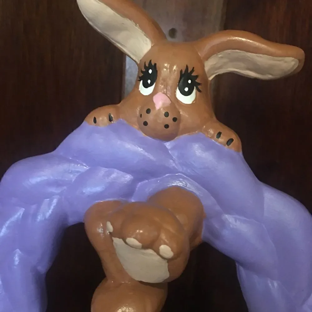 Ceramic Easter bunny hanging from basket